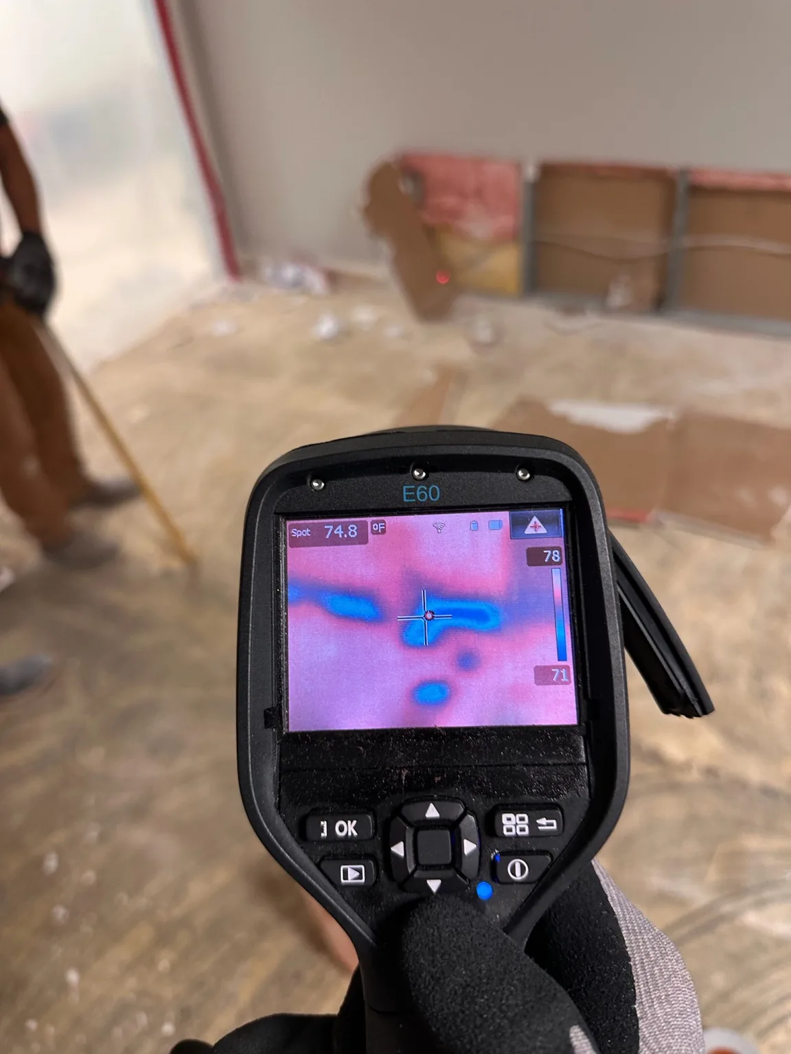 Thermal anomaly documented while selective demolition exposes the wall assembly.
