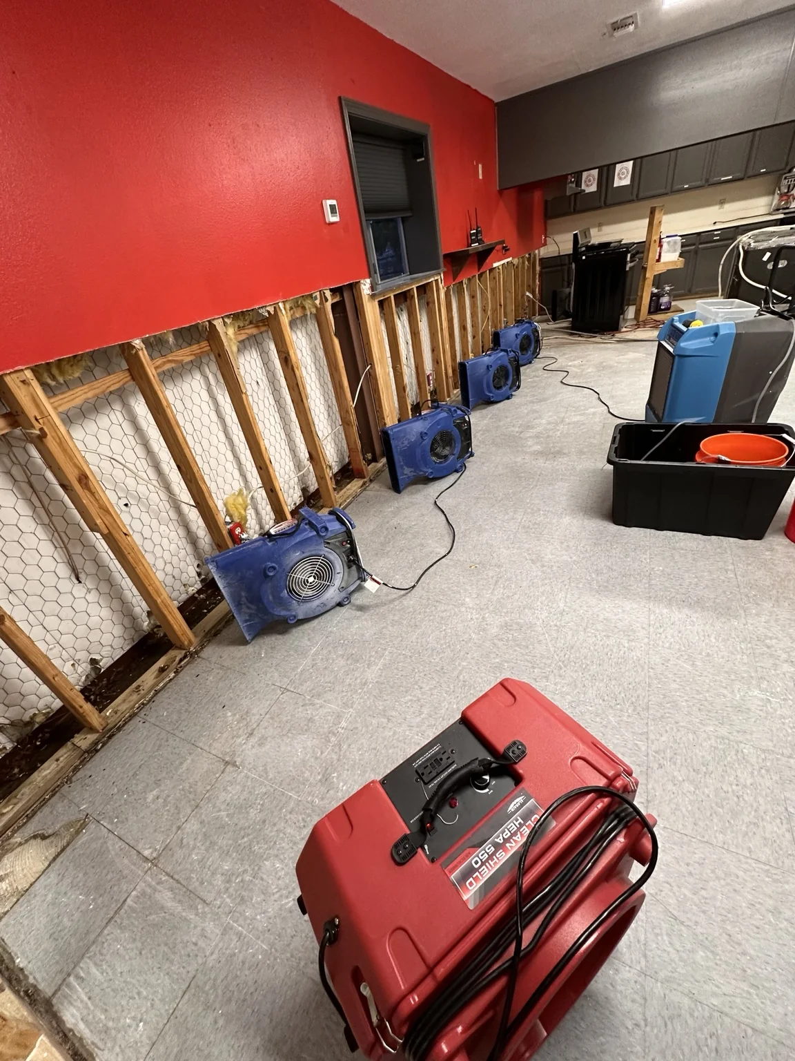 Drying system arranged at exposed wall assembly