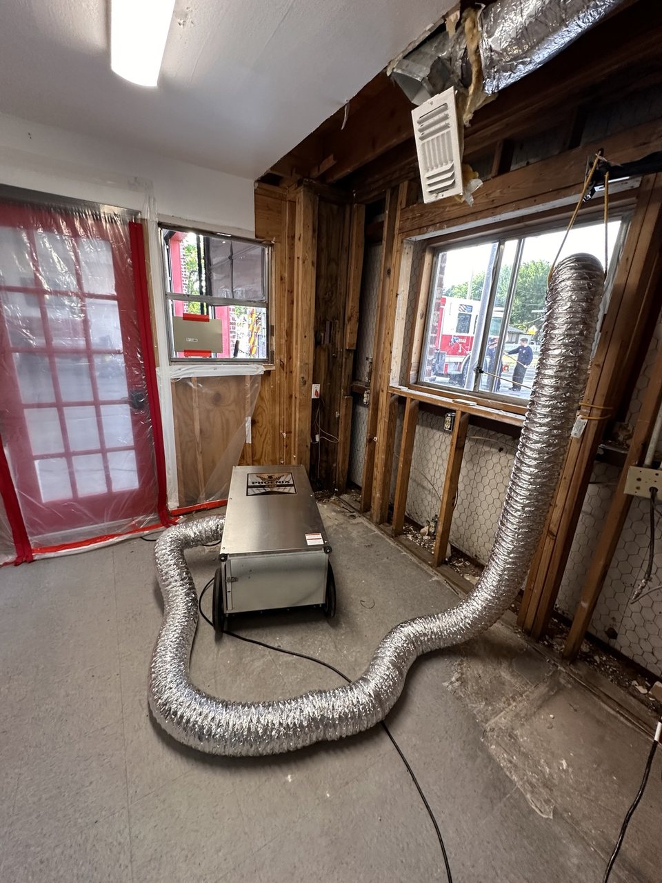 Same Day Mitigation equipment operating inside a municipal fire station during documented water-loss mitigation work